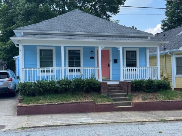 WOOD LAP SIDING REPLACED WITH JAMES HARDIE PRIMED 8.25