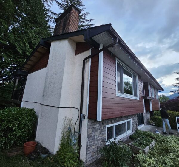 Exterior upgrade with new red James Hardie siding installed